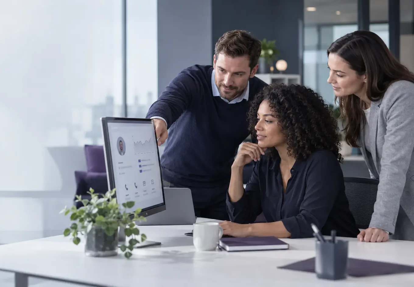 Sales, service and operations colleagues reviewing a shared customer record