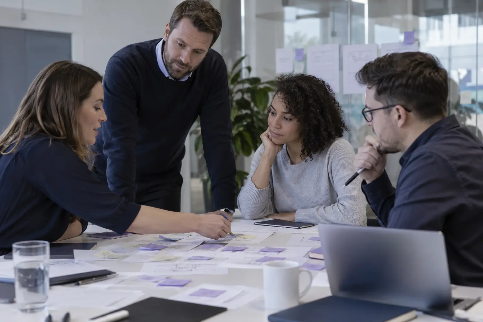 Consultants mapping manual onboarding and reporting processes with financial operations staff