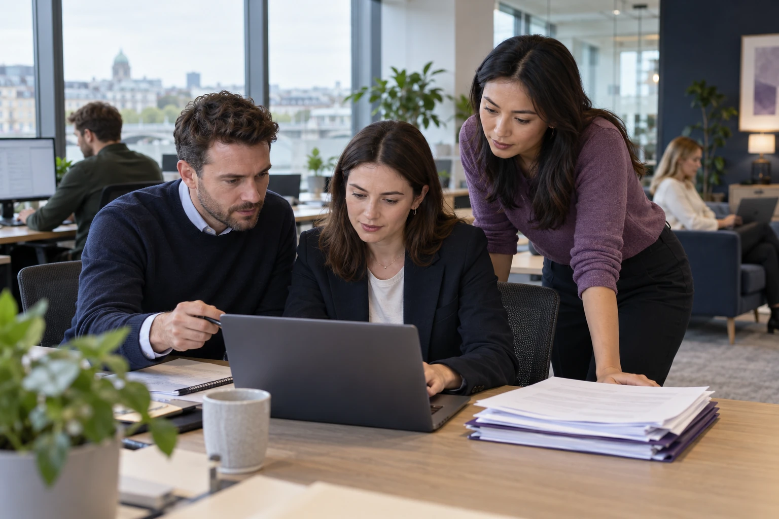 An operations team reviewing a document-processing workflow beside business forms.